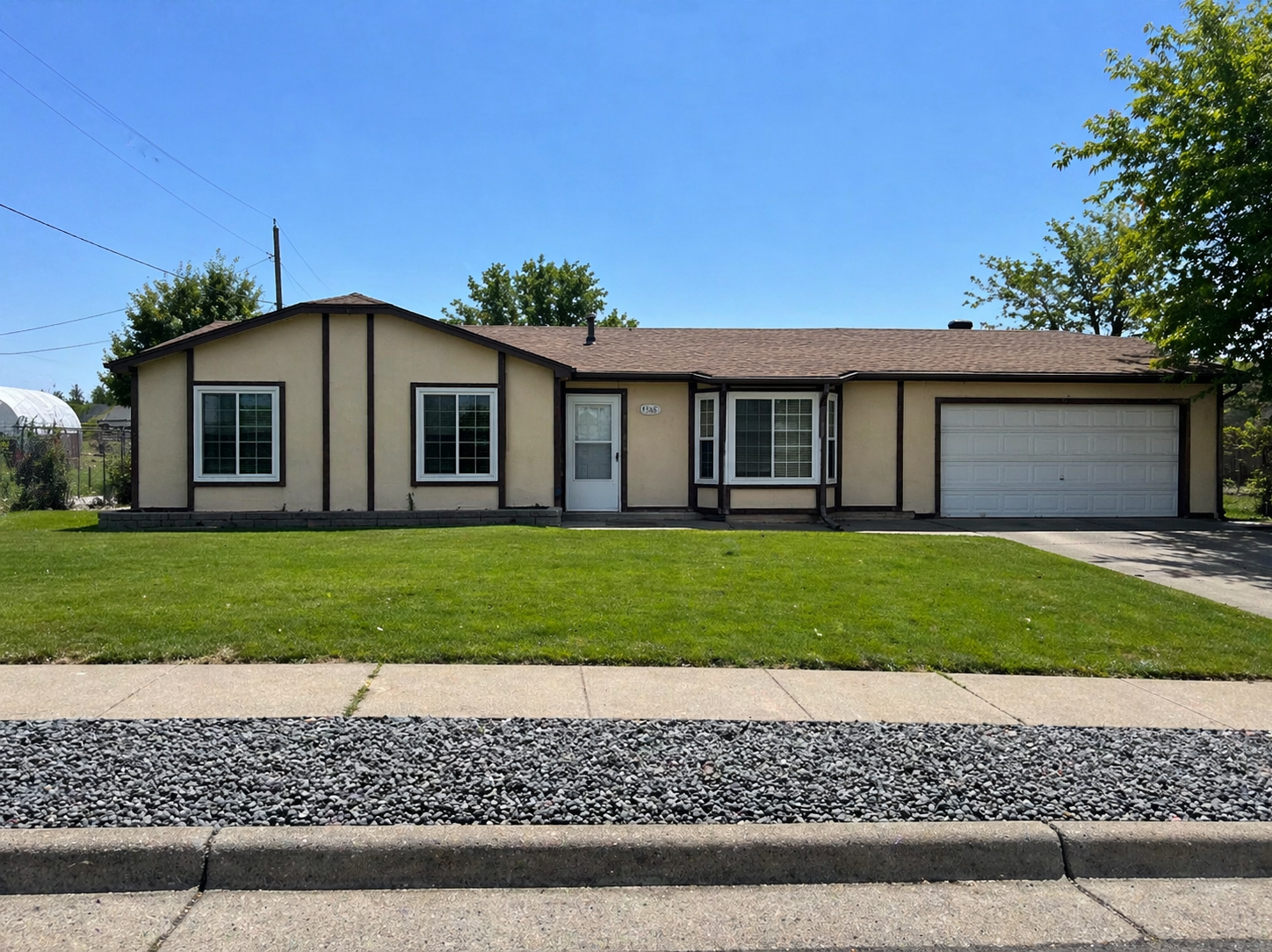Before: original wood siding exterior in Layton, Utah
