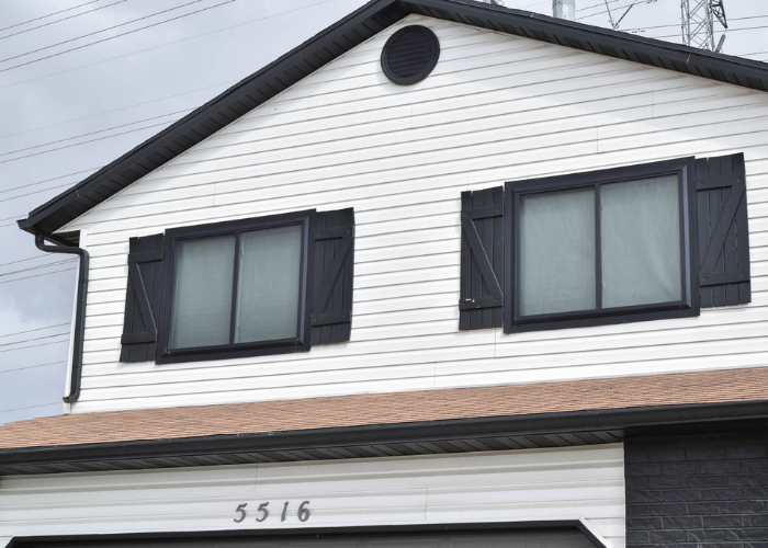 Two sliding windows in front of Roy home