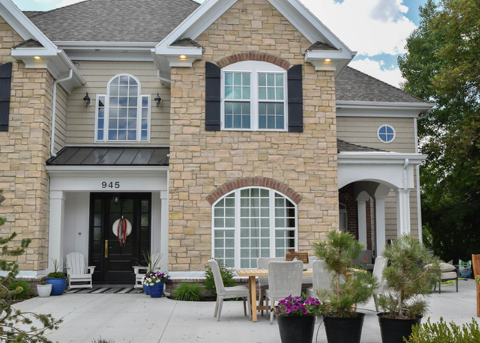 Front of house showing window above door and custom picture windows in Midway, Utah