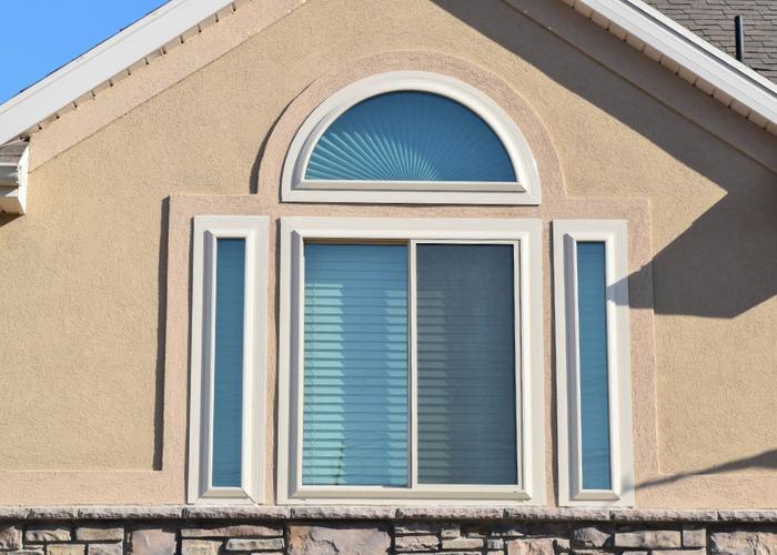Circle top window with sliding window below it in West Valley City