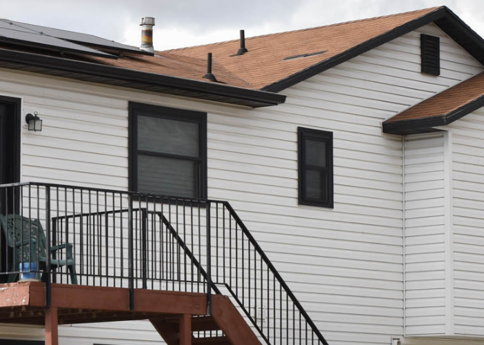 Close-up of double hung windows in back of house