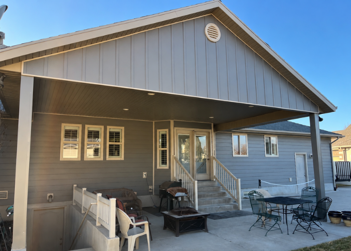 Back covered porch view with Ageless Slate Ascend Composite Cladding in Layton Utah