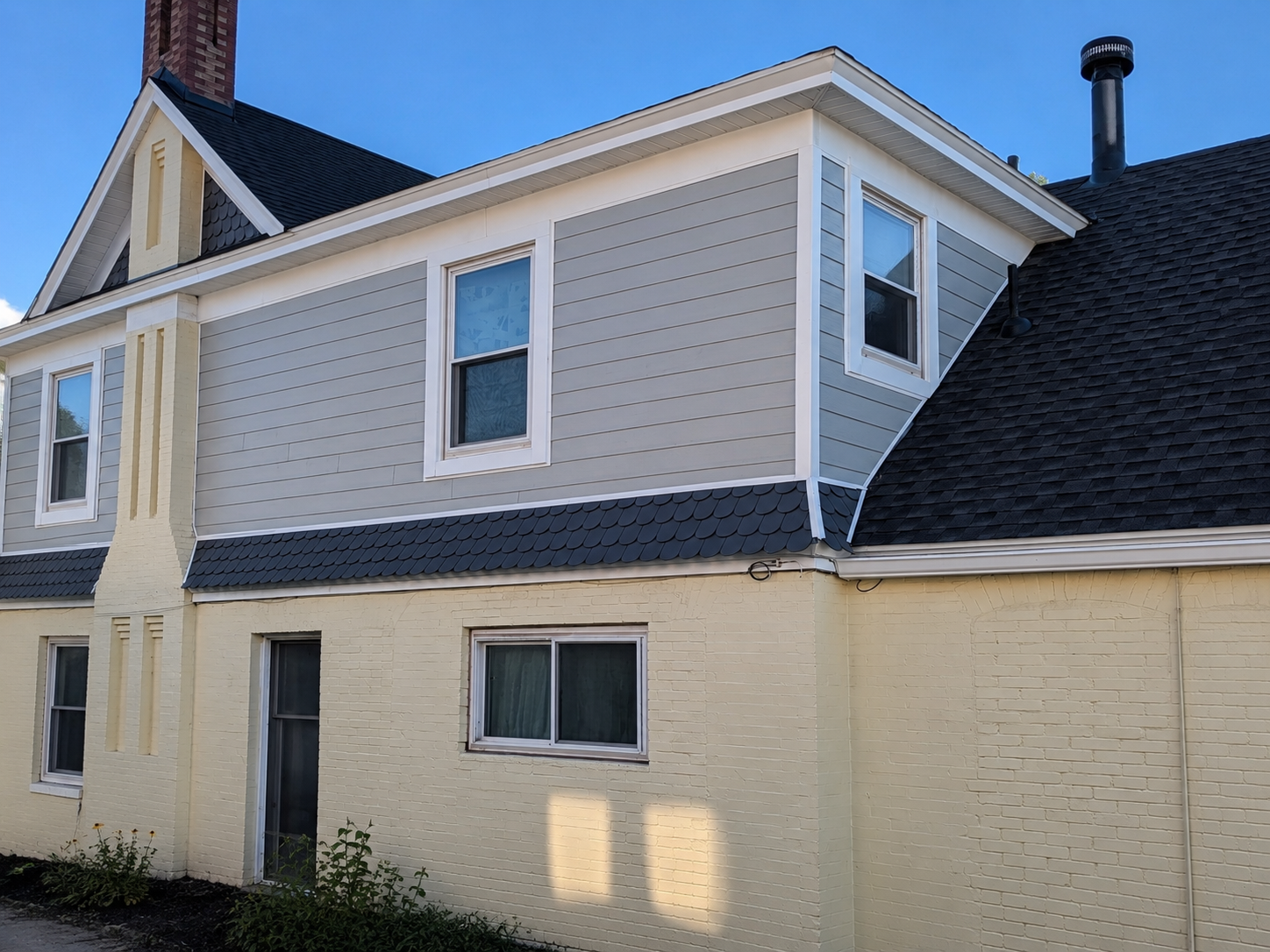 Back of house after view of Ogden, Utah home before siding replacement