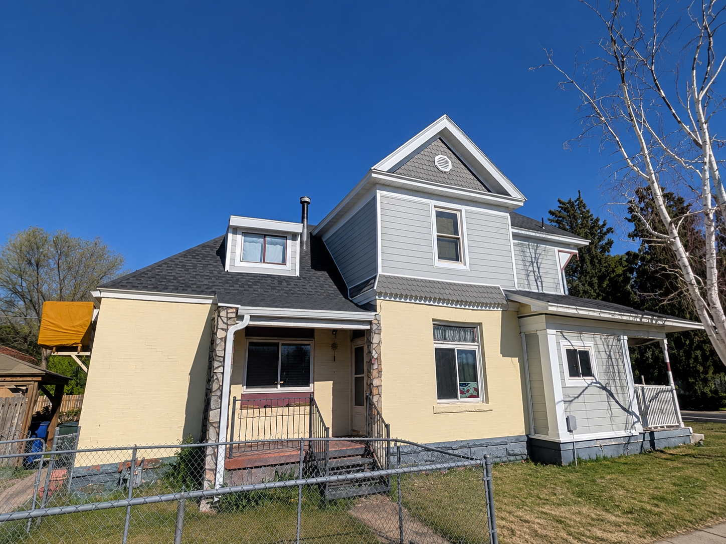 Finished side view of siding replacement in Ogden, Utah with Ascend Composite Cladding