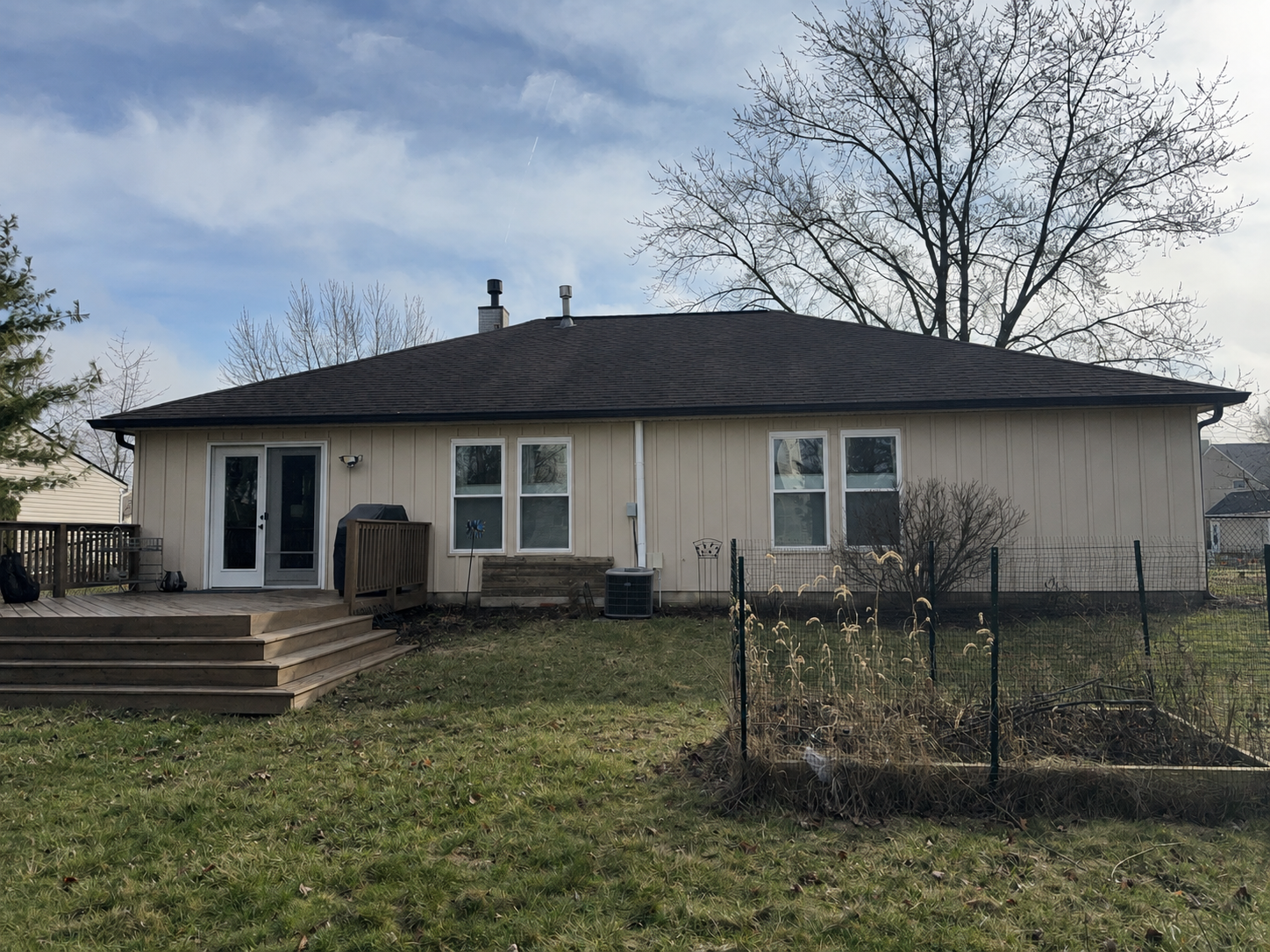 Back of Fishers, Indiana home after Monterey Sand Ascend Board and Batten siding replacement