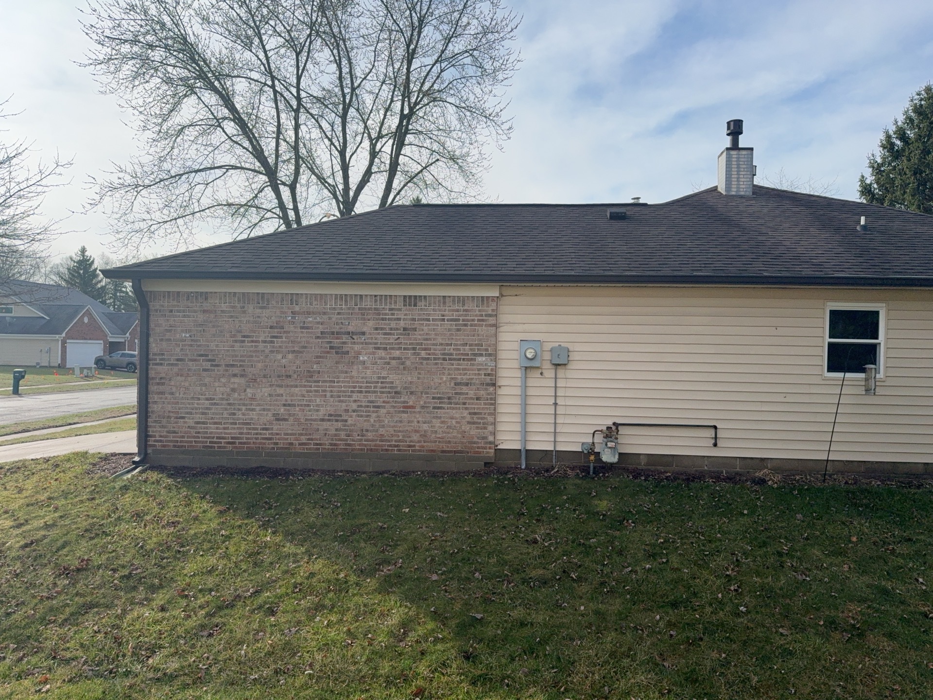 Side of Fishers, Indiana home before siding replacement