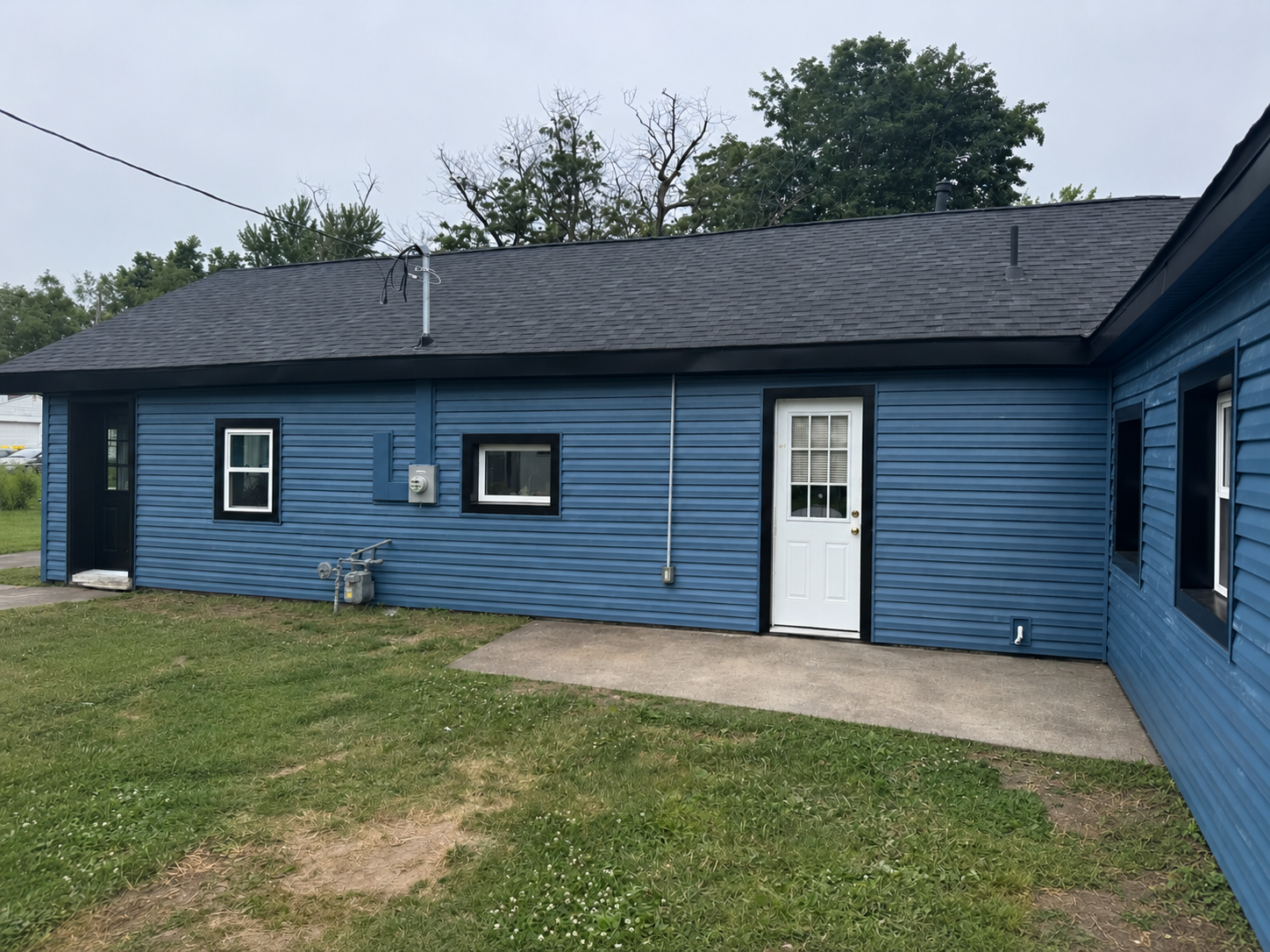 Rear door area after Indianapolis siding replacement with Laguna Blue siding